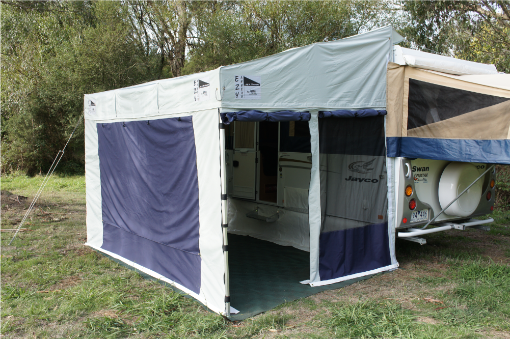 EZY Annexe setup against popup caravan. EZY Annexe walls, flooring, draft flap, and draft pillows complete the enclosure.