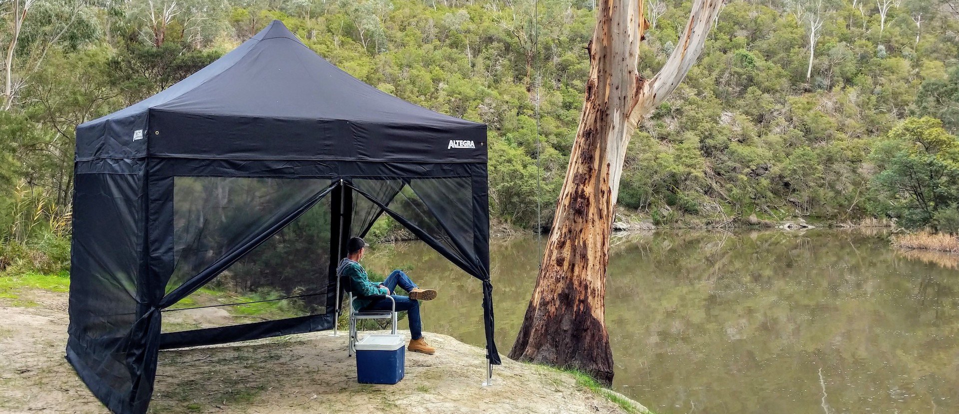 Gazebo Mesh Walls for your Altegra - keep the bugs out with fine fly screen walls that easily attach to your gazebo or marquee. 3x3m black Altegra gazebo with full mesh wallkit attached, next to Melbourne's Yarra river.