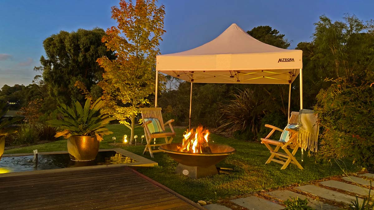 3x3m gazebo for backyard camping by Altegra - white gazebo set up for shelter while enjoying your backyard.