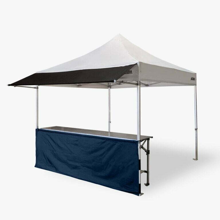 Altegra structured 3m half wall in navy blue connected to our Heavy Duty 3x3m gazebo, fitted with our 3m awning, and complete with a 3m folding table - a perfect exhibitor's tent, display stand, or market stall.